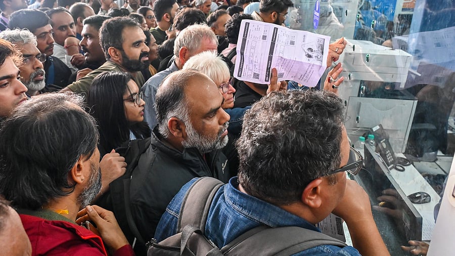 <div class="paragraphs"><p>Passengers crowd in front of a counter following cancellation of IndiGo flights in Bengaluru, on Friday. </p></div>
