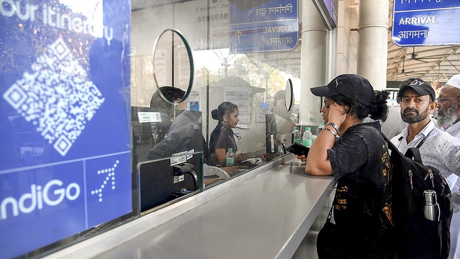 <div class="paragraphs"><p>Passengers at an IndiGo airlines counter amid flight disruptions, at Chhatrapati Shivaji Maharaj International Airport in Mumbai.</p></div>