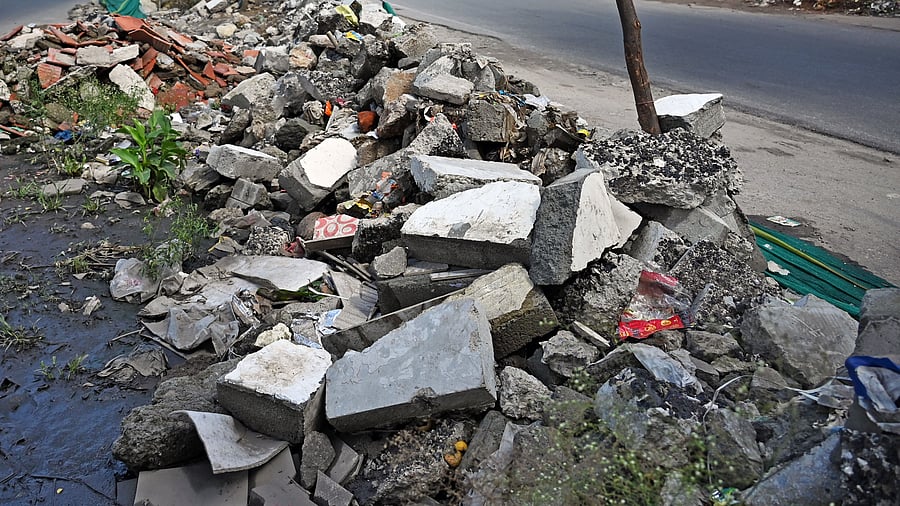 <div class="paragraphs"><p>Construction debris piled along the roadside in Koramangala. </p></div>