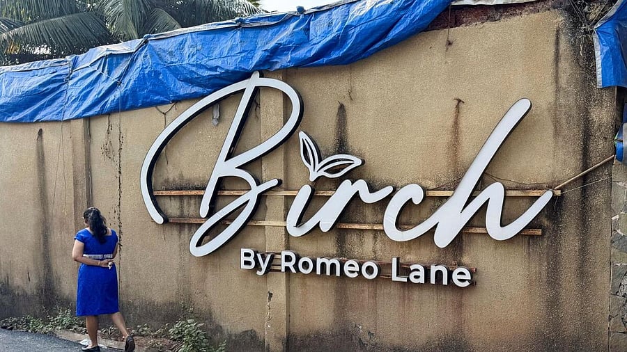 <div class="paragraphs"><p>A woman walks past the Birch by Romeo Lane nightclub, which has been sealed for investigation following a fire that killed multiple people, in Goa.</p></div>