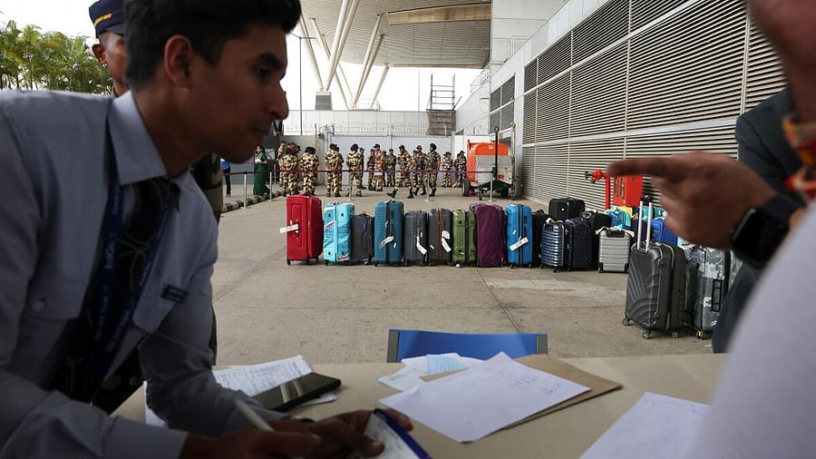 <div class="paragraphs"><p>Travellers fill out their details to reclaim luggage after IndiGo flight cancellations at Kempegowda International Airport in Bengaluru</p></div>