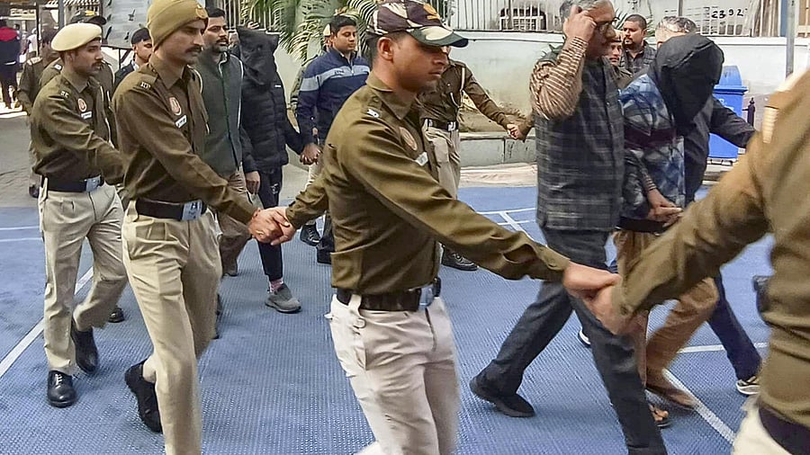 <div class="paragraphs"><p>Accused in the Red Fort blast case, face covered, while being produced at the Patiala House Court, in New Delhi.</p></div>