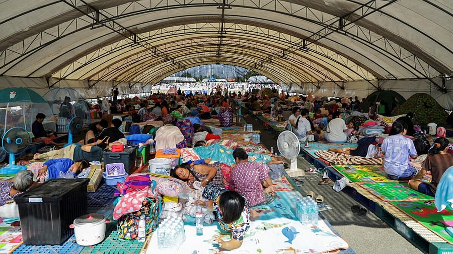 <div class="paragraphs"><p>People rest at a shelter, following fresh military clashes between Thailand and Cambodia along parts of their disputed border, in Buriram province, Thailand.</p></div>