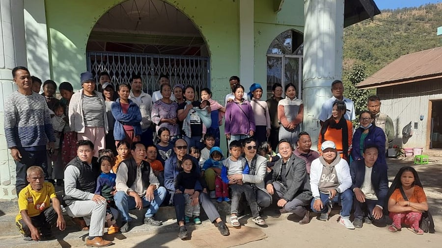 <div class="paragraphs"><p>Meitie MLA Y. Khemchand Singh with dispalced Kuki villagers, on Monday.  </p></div>