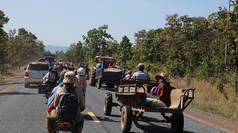 <div class="paragraphs"><p>People flee amid clashes between Thailand and Cambodia along a disputed border area</p></div>