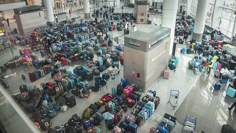 <div class="paragraphs"><p>Luggage of passengers piled up at the Indira Gandhi International Airport amid IndiGo flight disruptions, in New Delhi, Monday, Dec. 8, 2025.</p></div>