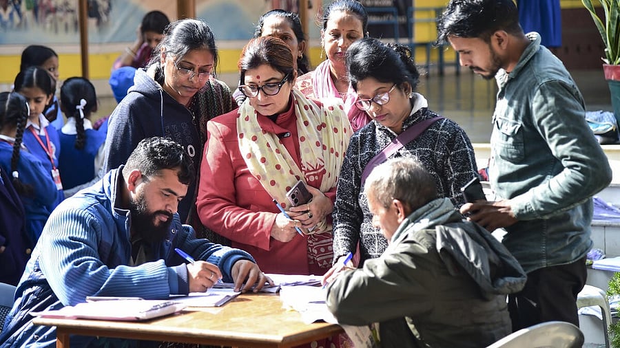 <div class="paragraphs"><p>Booth Level Officers (BLOs) collect enumeration forms from voters during the ongoing Special Intensive Revision (SIR) of electoral rolls, in Prayagraj.</p></div>