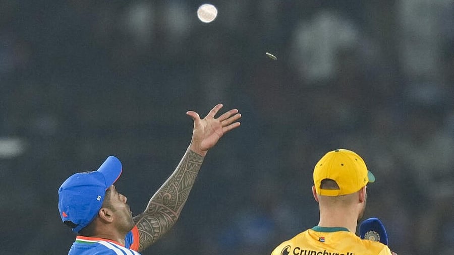 <div class="paragraphs"><p>India's captain Suryakumar Yadav tosses the coin as South Africa's captain Aiden Markram looks on before the start of the first T20I cricket match between India and South Africa at Barabati Stadium, in Cuttack.</p></div>