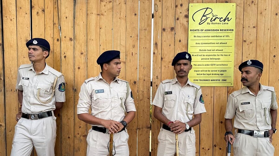 <div class="paragraphs"><p>Policemen stand guard outside the Birch by Romeo Lane nightclub which has been sealed for investigation following a fire that killed multiple people, in Goa.</p></div>