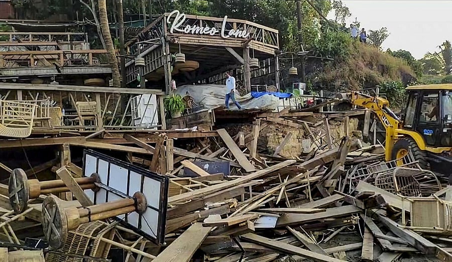 <div class="paragraphs"><p>An excavator demolishes wooden structures at Romeo Lane on Anjuna beach after a fire at the adjacent Birch by Romeo Lane nightclub killed 25 people, as the state administration begins pulling down the tourism property, in Goa, Tuesday, Dec. 9, 2025.</p></div>