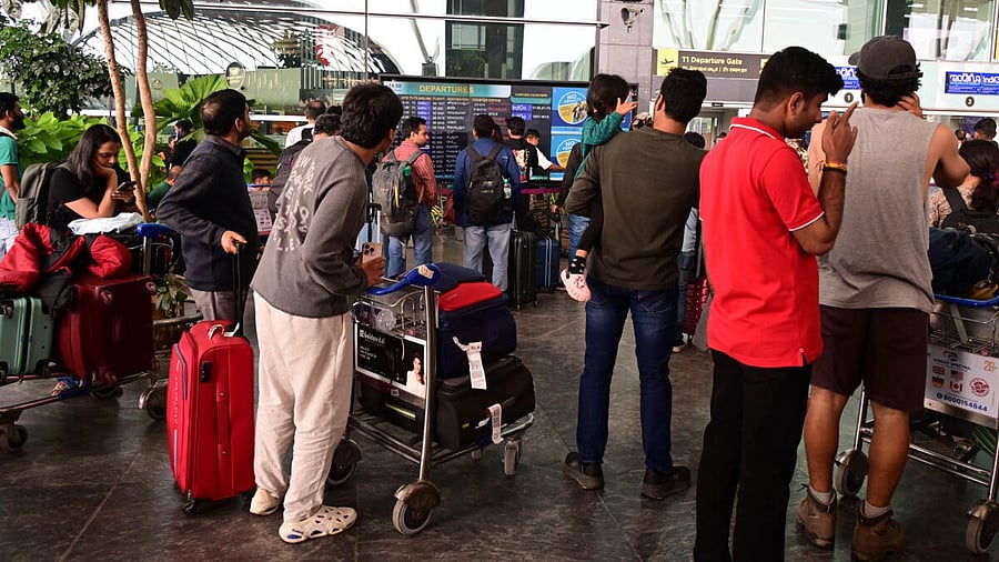<div class="paragraphs"><p>Passengers wait outside the Indigo airlines kiosk at Kempegowda International Airport in Bengaluru.</p></div>
