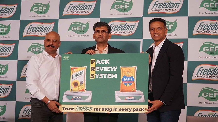 (From right) Former Indian cricketer Rahul Dravid, Gemini Edibles & Fats India Ltd Senior V-P - Sales & Marketing P Chandra Shekhara Reddy, and Freedom Healthy Cooking Oils Marketing Head Chetan Pimpalkhute launch the campaign in Bengaluru on Thursday.