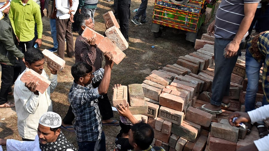 <div class="paragraphs"><p>People carry bricks in view of former TMC MLA Humayun Kabir's plan to lay the foundation stone for a mosque, modelled on Ayodhya’s Babri Masjid, at Rejinagar in West Bengal’s Murshidabad district, escalating political temperatures in the state.</p></div>