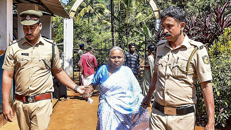 <div class="paragraphs"><p>An elderly woman being assisted by police officials at a polling booth during the second phase of Kerala local body elections, in Wayanad district.</p></div>