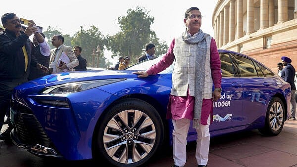 <div class="paragraphs"><p>New and Renewable Energy Minister Pralhad Joshi arrives in a hydrogen fuel cell electric car, during the winter session in Parliament.</p></div>