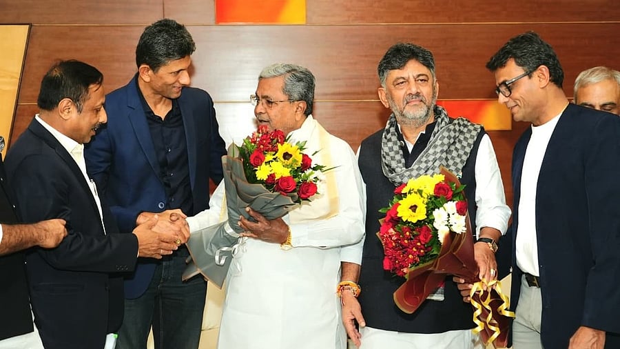 Newly elected president of Karnataka State Cricket Association (KSCA) Venkatesh Prasad, vice president Sujit Somasundar greet Chief Minister Siddaramaiah and his deputy D K Shivakumar, at the Circuit House in Belagavi on Wednesday. Former KSCA treasurer Vinay Mruthyunjaya is also seen.
