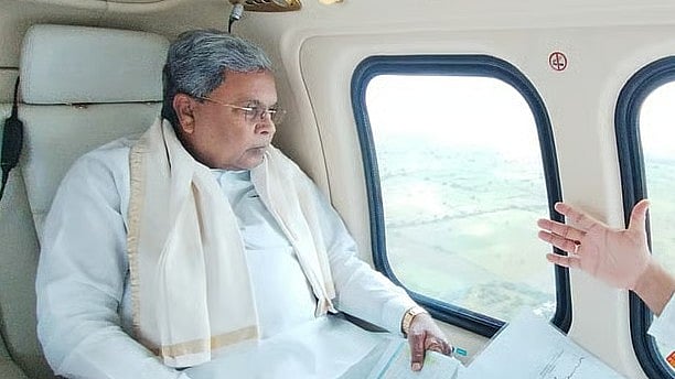 <div class="paragraphs"><p>Chief Minister Siddaramaiah during an aerial survey.</p></div>