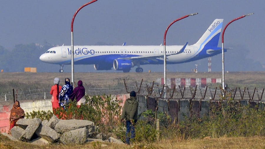 <div class="paragraphs"><p>People look on as an Indigo airplane prepares for takeoff even as several flights of the airline were cancelled or delayed, at Birsa Munda Airport in Ranchi.</p></div>
