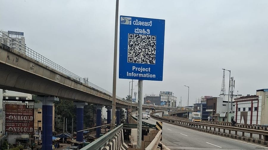 A QR code board placed along National Highway 48 (Tumakuru Road) in Bengaluru. DH PHOTO