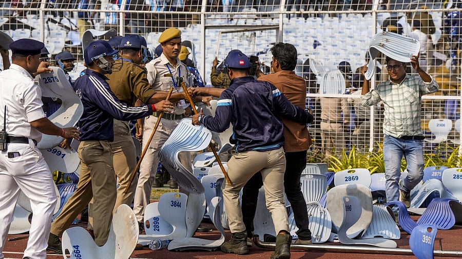 <div class="paragraphs"><p>Security personnel try to stop a person amid chaos during an event of Argentine footballer Lionel Messi as part of his 'G.O.A.T. India Tour 2025', at Vivekananda Yuba Bharati Krirangan (VYBK), in Kolkata, Saturday, Dec. 13, 2025.</p></div>