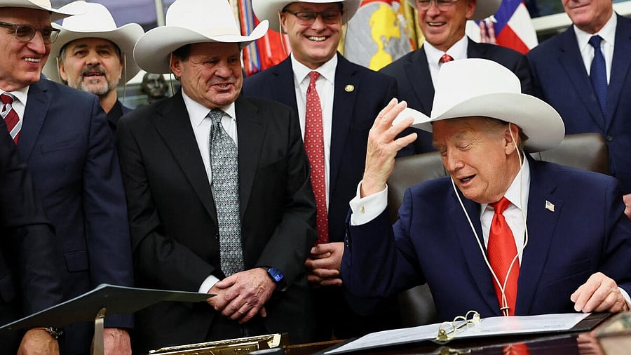 <div class="paragraphs"><p>U.S. President Donald Trump signs a bill to award congressional gold medals to members of the 1980 U.S. Olympic men's hockey team, in Washington. Credit: Reuters</p></div>
