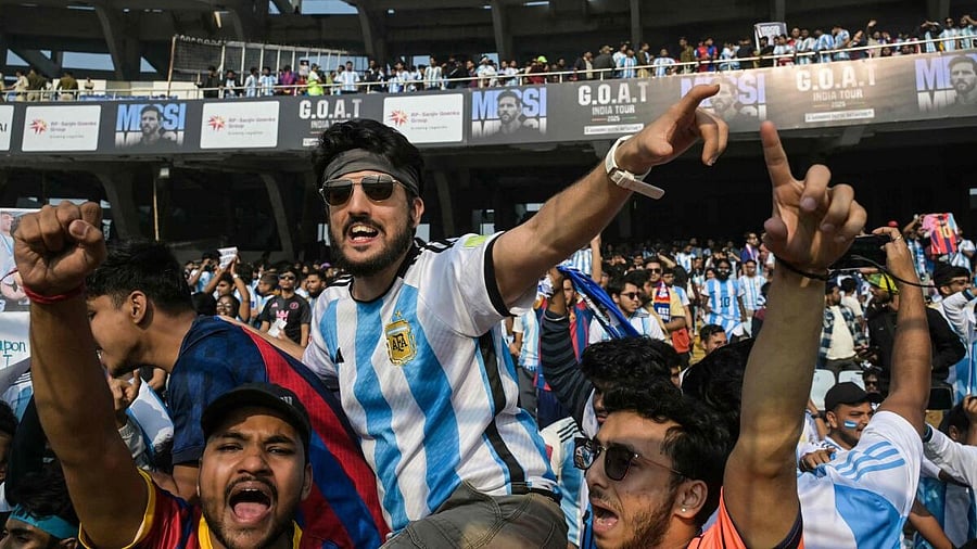 <div class="paragraphs"><p>Fans of Argentinian football star Lionel Messi cheer from the stands before his arrival during the GOAT India Tour 2025 at the Salt Lake Stadium in Kolkata.</p></div>