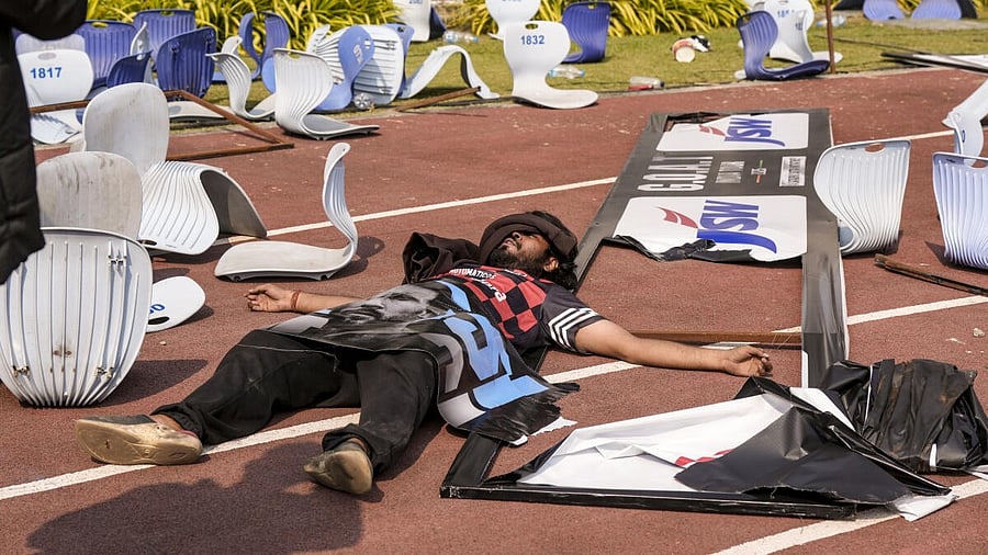 <div class="paragraphs"><p>A person lays amidst broken chairs following chaos during an event of Argentine footballer Lionel Messi as part of his 'G.O.A.T. India Tour 2025', at Vivekananda Yuba Bharati Krirangan (VYBK), in Kolkata, Saturday, Dec. 13, 2025. Fans protested after failing to catch a clear glimpse of the footballer despite paying hefty sums for tickets.</p></div>