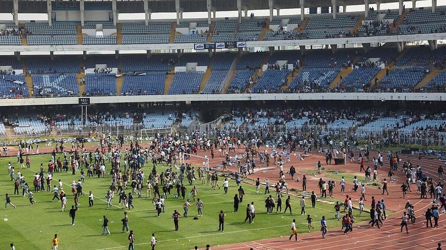 <div class="paragraphs"><p>Riot police are deployed as disappointed fans throw chairs and enter the field after Argentine soccer star Lionel Messi left the Vivekananda Yuva Bharati Krirangan stadium during his India tour, Kolkata.</p></div>