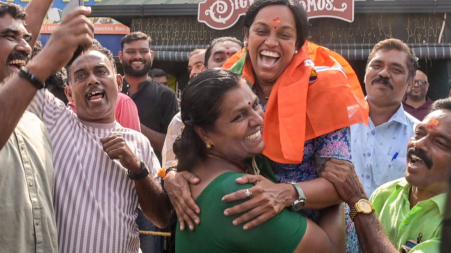 BJP workers celebrate during the counting of votes for the local body elections, in Thiruvananthapuram, on Saturday. PTI