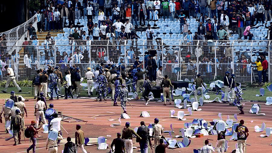 Security personnel clash with angry football fans at the Salt Lake stadium in Kolkata on Saturday. REUTERS