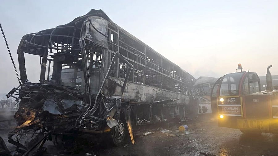 <div class="paragraphs"><p>Cranes clear the charred remains of buses after a fog-hit pile-up involving several buses and cars triggered fires on the Yamuna Expressway, in Mathura, Tuesday, Dec. 16, 2025.</p></div>