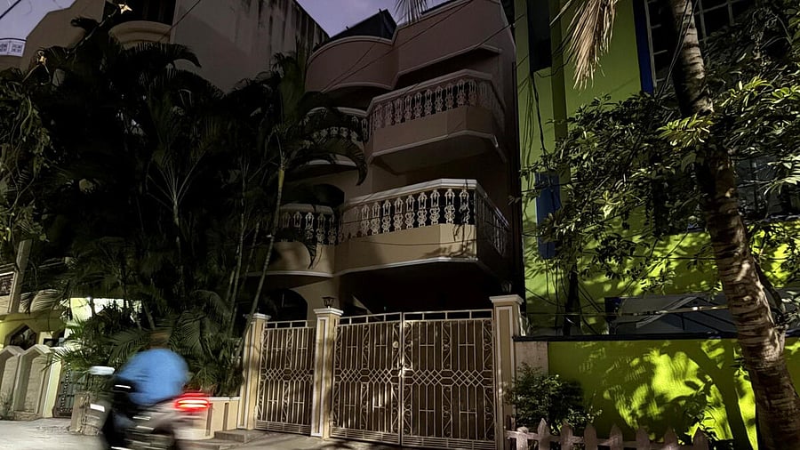 <div class="paragraphs"><p>A man rides his motorbike past the house of the family of a gunman who was shot dead by police during a shooting at a Hanukkah event at Sydney's Bondi Beach, in Hyderabad</p></div>