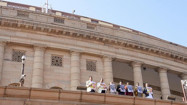<div class="paragraphs"><p>Congress MPs Praniti Shinde and Kumari Selja along with other opposition MPs participate in a protest against the VB-G RAM G Bill, introduced by the union government to replace the Mahatma Gandhi National Rural Employment Guarantee Act (MGNREGA), 2005, during the Winter session of Parliament, in New Delhi.</p></div>