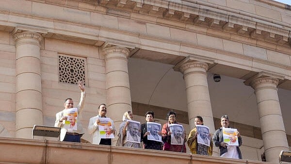 <div class="paragraphs"><p>Congress MPs Praniti Shinde and Kumari Selja along with other opposition MPs participate in a protest against the VB-G RAM G Bill, introduced by the union government to replace the Mahatma Gandhi National Rural Employment Guarantee Act (MGNREGA), 2005, during the Winter session of Parliament, in New Delhi.</p></div>