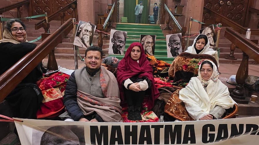 <div class="paragraphs"><p>Opposition MPs protesting against the passage of the VB-G RAM G Bill, in the Parliament House complex on Thursday night. <br></p></div>