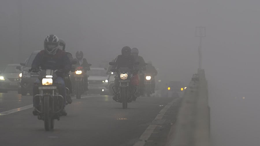 <div class="paragraphs"><p>Vehicles ply on a road amid dense fog on a winter morning, in New Delhi.</p></div>