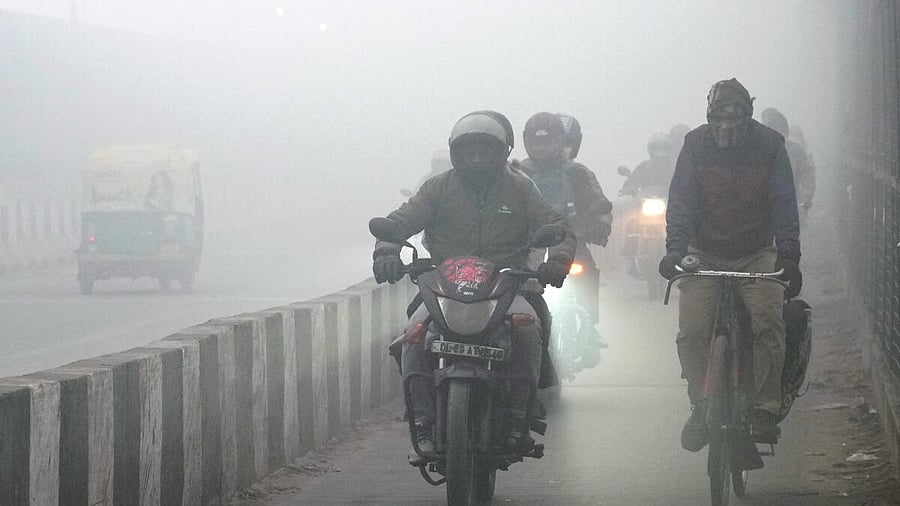 <div class="paragraphs"><p>Commuters brave dense fog on a winter morning, in New Delhi.</p></div>