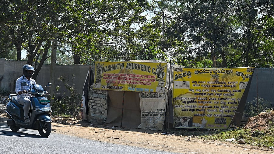 <div class="paragraphs"><p>At the busy entrance to Dr Vishnuvardhan Road, a roadside tent named ‘Shivashakthi Ayurvedic Camp’ offers ‘guaranteed cures’ for sexual health and mental stress. </p></div>