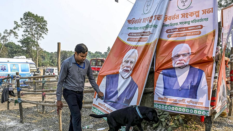 <div class="paragraphs"><p>A security personnel with a sniffer dog inspects the venue of a public meeting as part of preparations for Prime Minister Narendra Modi's scheduled visit.</p></div>
