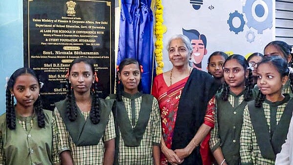 <div class="paragraphs"><p>Union Finance Minister Nirmala Sitharaman poses for a picture with students during the launch of Cyient AI Labs (CyAILS) - ‘VijAIpatha’ in government schools of Hosapete, Karnataka.</p></div>