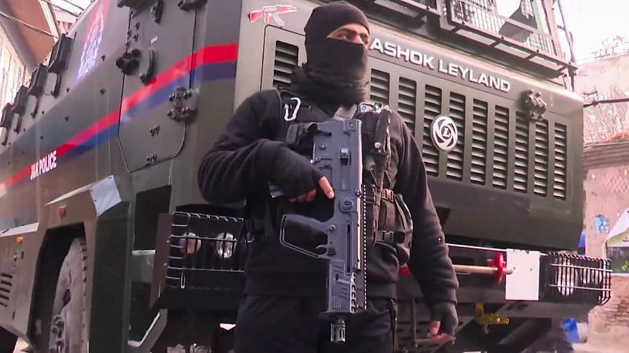 <div class="paragraphs"><p>A security personnel stands guard on a road in J&K.</p></div>