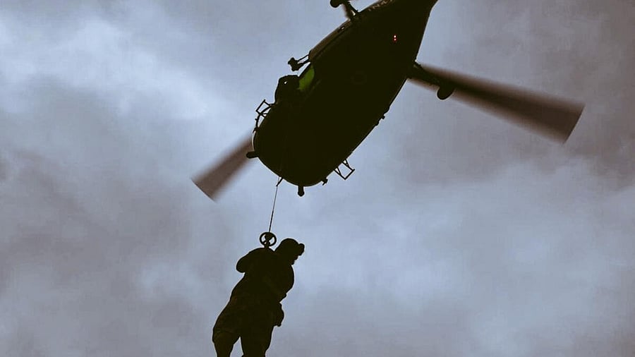 <div class="paragraphs"><p>Indian Navy's ship-borne helicopters lift a local resident during a rescue operation 'Sagar Bandhu', in Sri Lanka.</p></div>