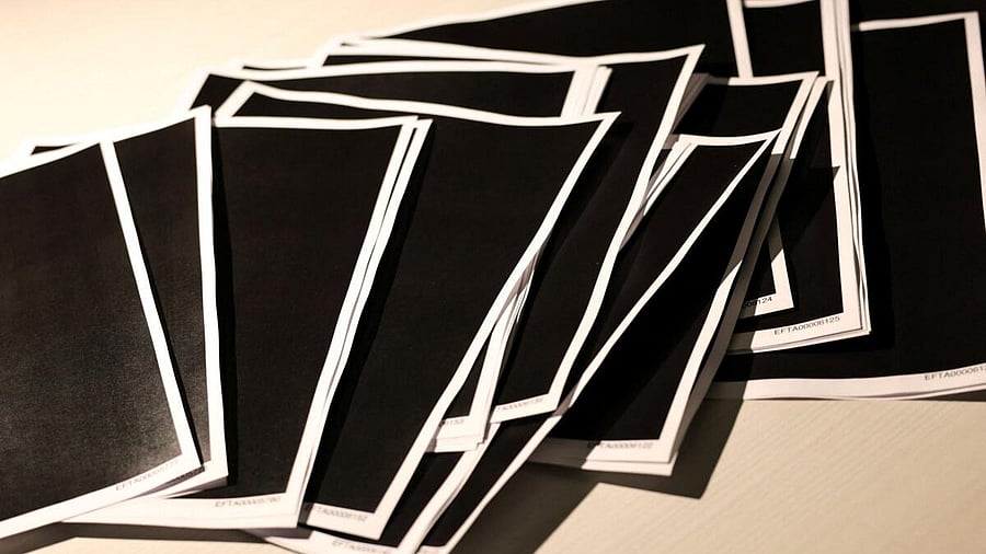 <div class="paragraphs"><p>documents from disgraced late financier and sex offender Jeffrey Epstein, including a sheaf of entirely redacted pages, are seen in this handouts released by the U.S. Justice Department.</p></div>