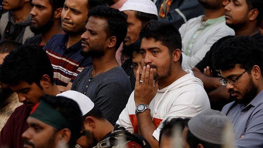 <div class="paragraphs"><p>People mourn as they join the funeral prayer for Sharif Osman Hadi, a student leader, who died after being shot in the head, at the Parliament building area of Manik Mia Avenue, in Dhaka, Bangladesh, December 20, 2025.</p></div>