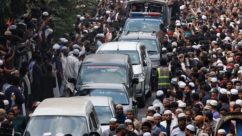 <div class="paragraphs"><p>A convoy carrying the body of Sharif Osman Hadi, a student leader, who died after being shot in the head, moves along the crowd after the funeral prayer, in Dhaka, Bangladesh, December 20, 2025.</p></div>