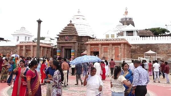 <div class="paragraphs"><p>Devotees gather outside the Jagannath Temple, in Puri.</p></div>