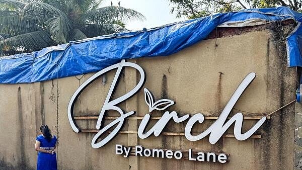 <div class="paragraphs"><p>A woman walks past the Birch by Romeo Lane nightclub, which has been sealed for investigation following a fire that killed multiple people, in Goa</p></div>
