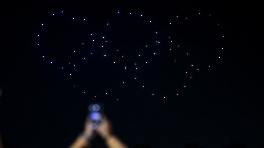 <div class="paragraphs"><p>Drones form the shape of the Olympic rings during the 18th Kankaria Carnival, in Ahmedabad.</p></div>
