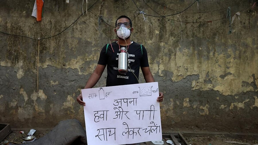 <div class="paragraphs"><p>Harish Monsoon, 25, a demonstrator, poses for a photograph during a protest demanding government to take immediate steps to control air pollution</p><p></p></div>