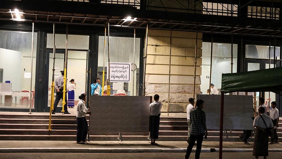 <div class="paragraphs"><p>Poll station workers stand outside Kyauktada Township, Polling Station No. 1, before it opens for voting on the day of the general elections in Kyauktada, Myanmar.</p></div>